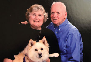 Rick Kiley ’63, his wife and dog. Links to his story